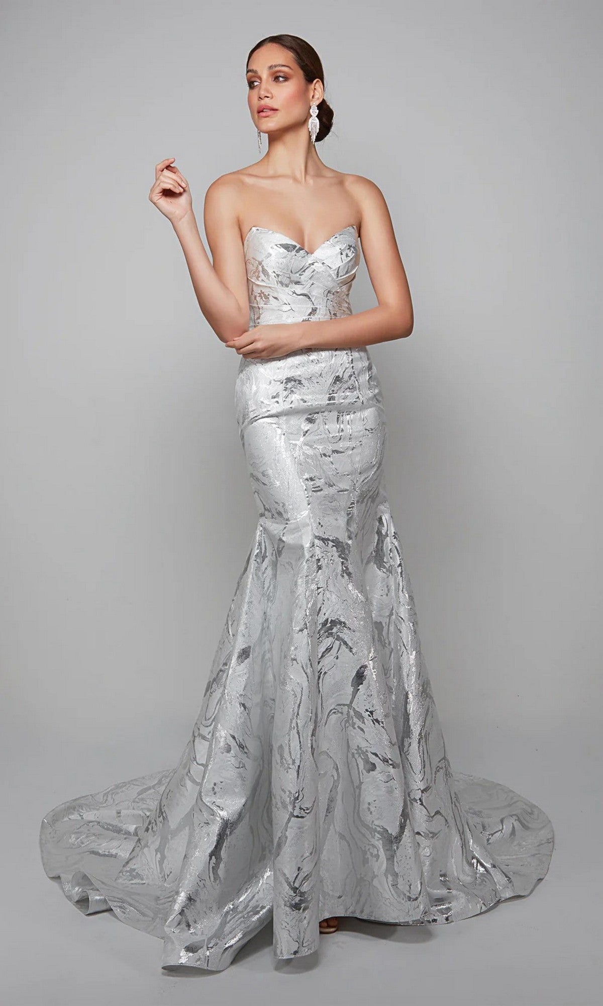 A woman models the Long White Dress: Alyce 7055, a strapless floor-length formal gown with a marble-like pattern, ideal for mother-of-the-bride attire, against a plain gray background.